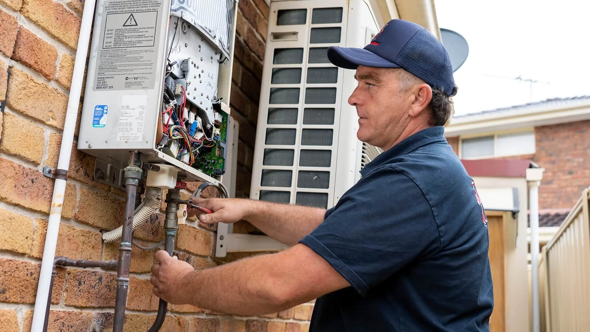 Emergency plumber at job